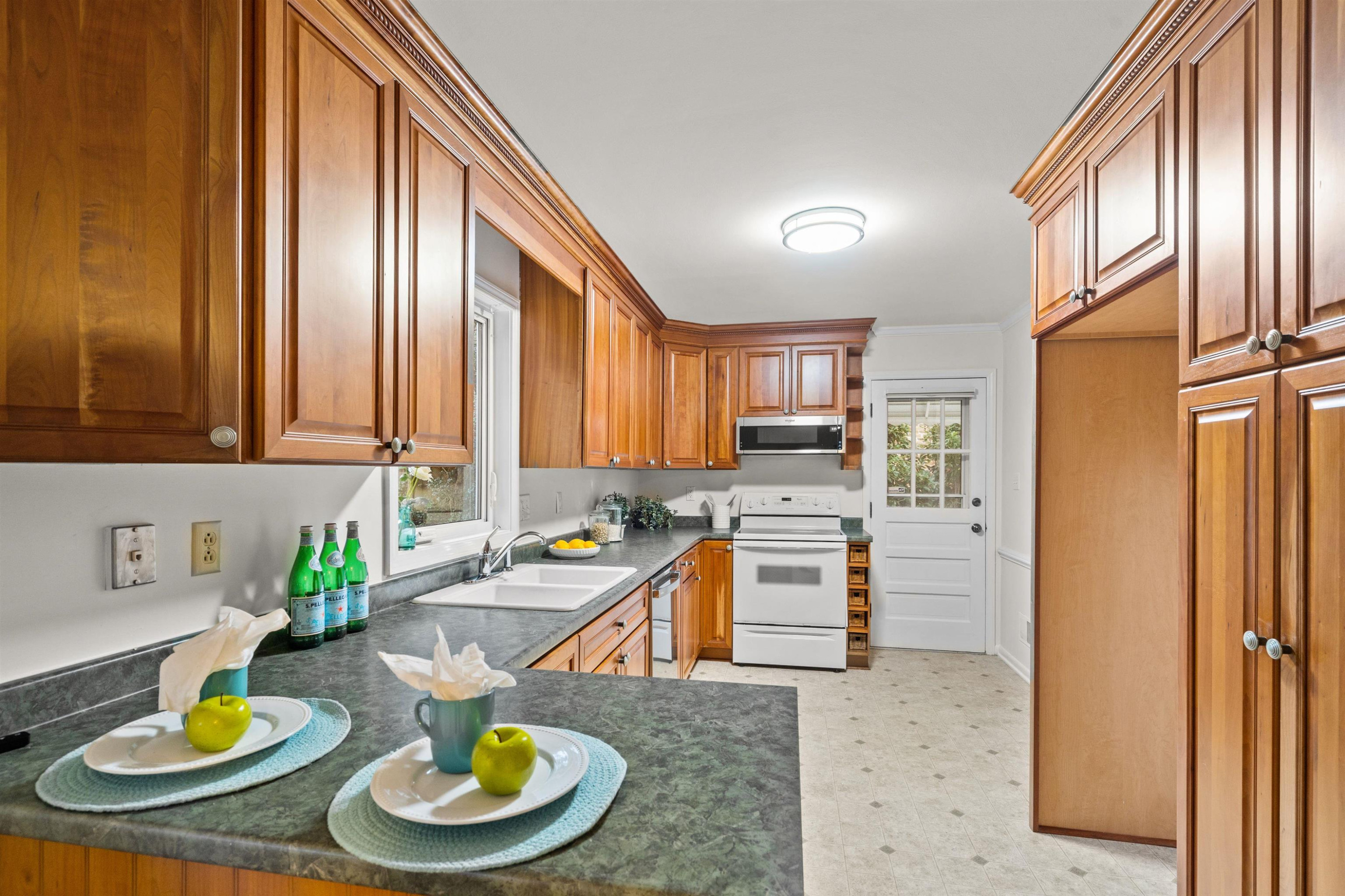 309 Glen Valley Road Raleigh, NC 27609 - Photo 13 of 34 Kitchen with updated cabinets and stainless steel dishwasher. Kitchen