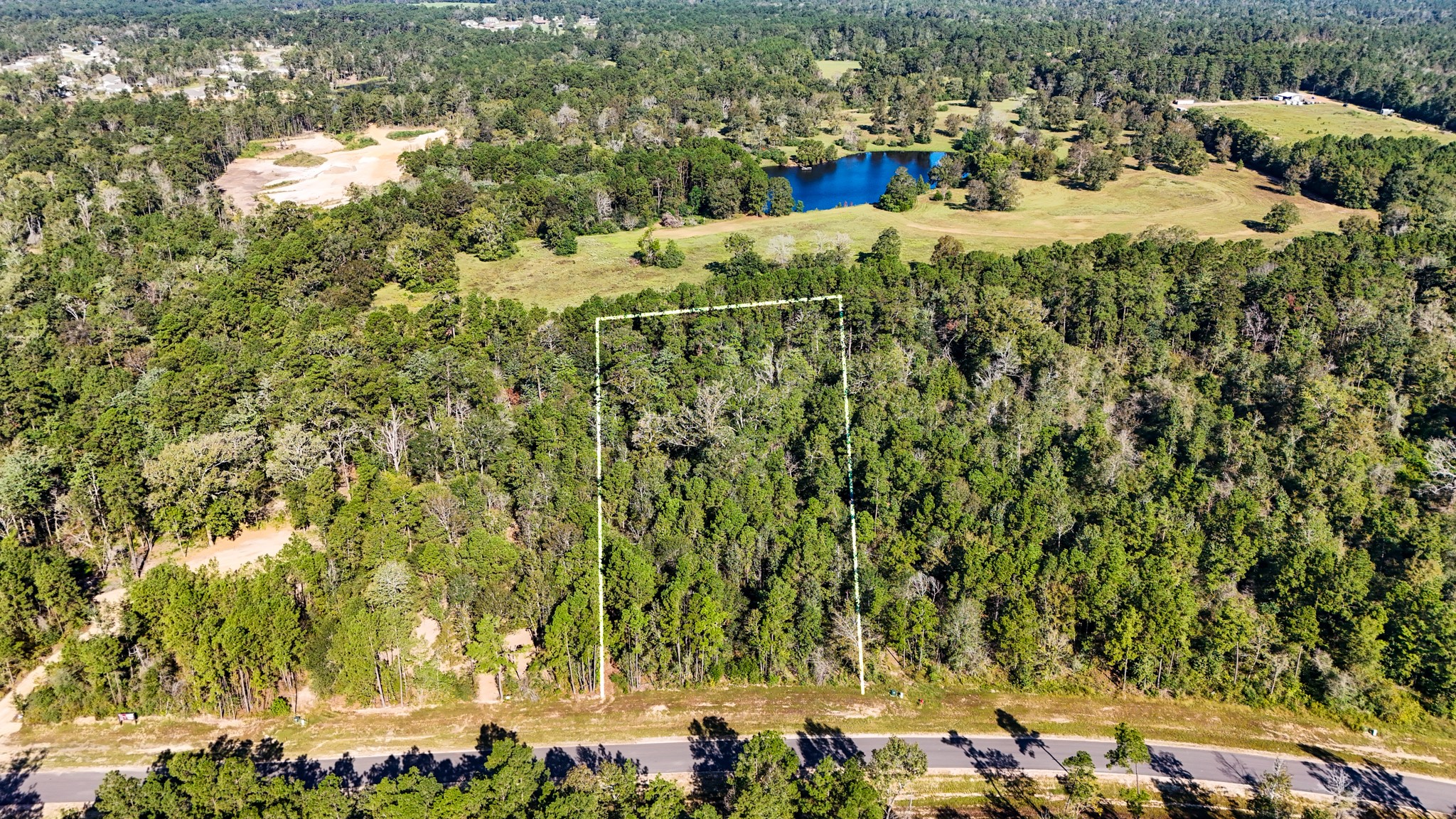 15821 Ridge Rock Road Willis, TX 77378 - Photo 6 of 21 This aerial photo shows the lush, wooded area offering a tranquil, natural setting that is ideal for your custom home with privacy and scenic views.