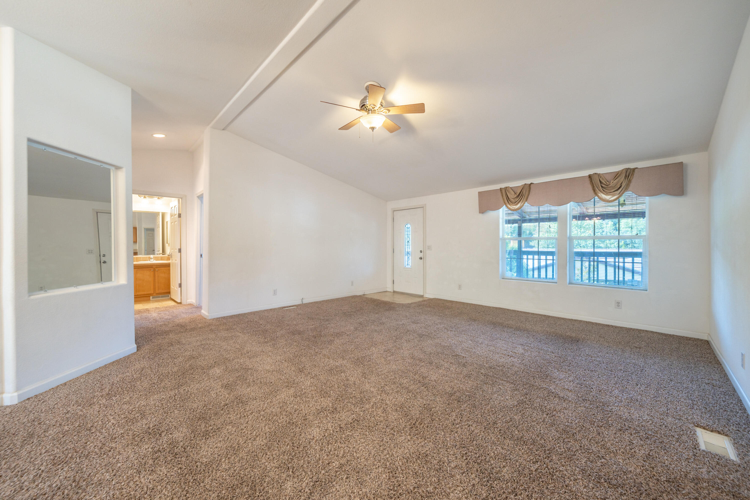 22151 Ravine Court Redding, CA 96003 - Photo 15 of 34 a view of a livingroom with a window