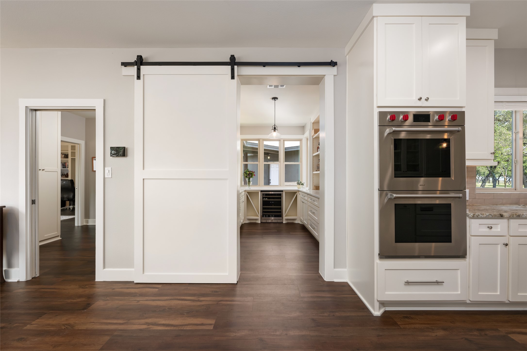 1276 Canyon Crossing View Dripping Springs, TX 78620 - Photo 11 of 33 a view of a kitchen with a refrigerator a stove top oven hallway