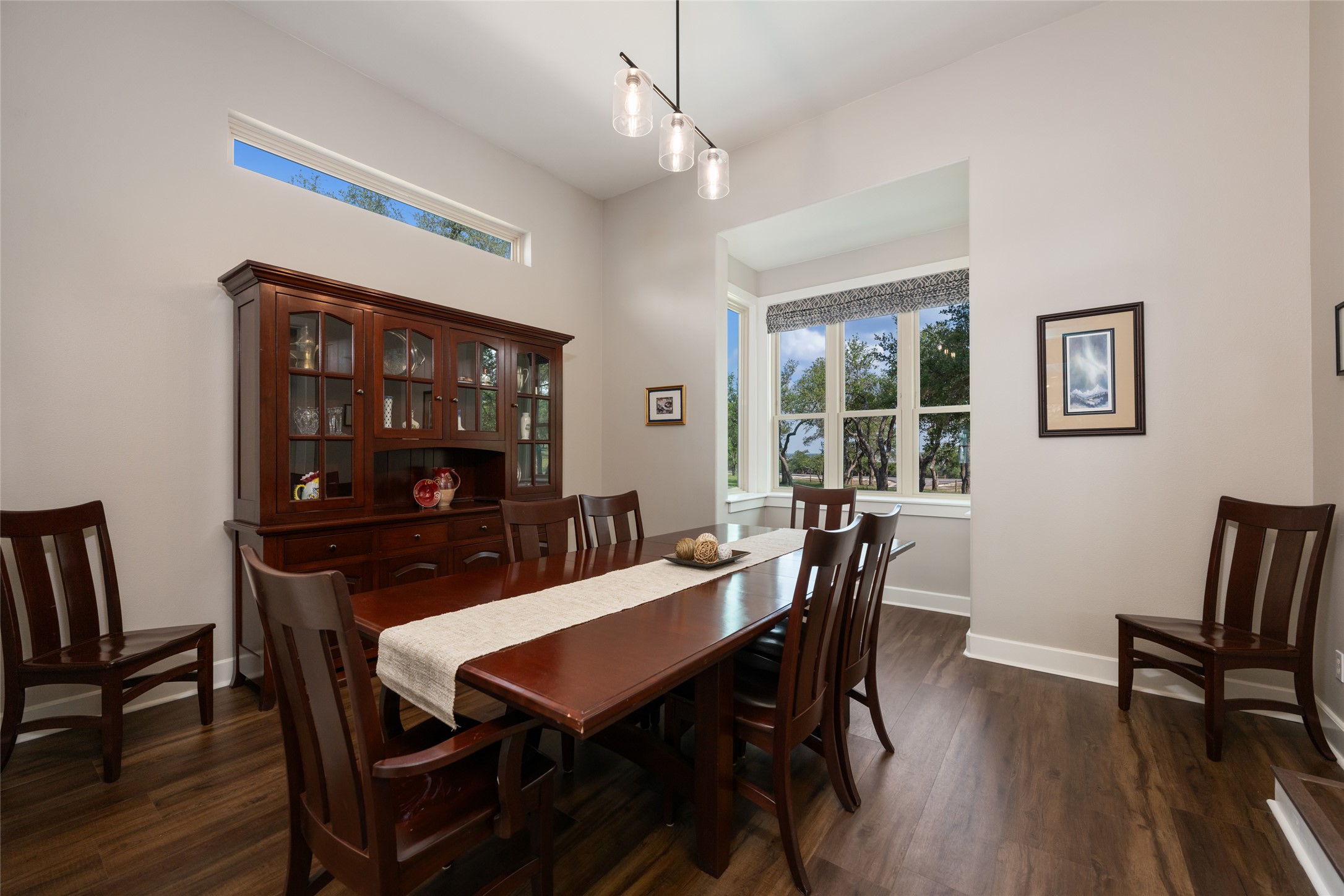 1276 Canyon Crossing View Dripping Springs, TX 78620 - Photo 12 of 33 a view of a dining room with furniture and wooden floor