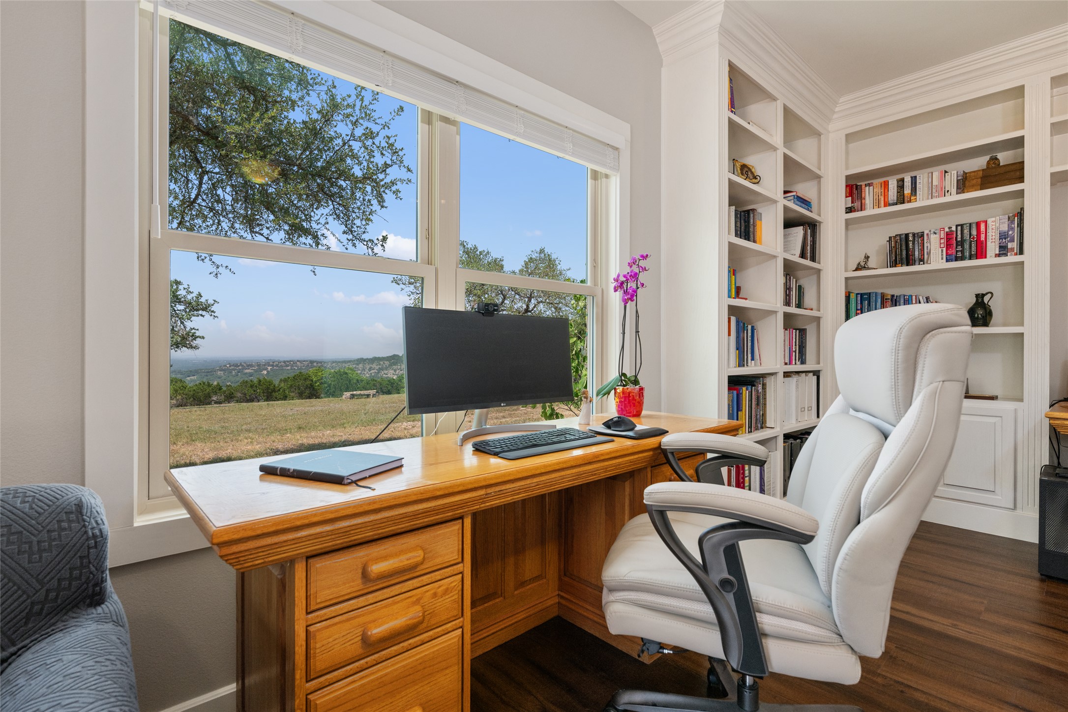 1276 Canyon Crossing View Dripping Springs, TX 78620 - Photo 17 of 33 a view of a workspace with furniture and a potted plant