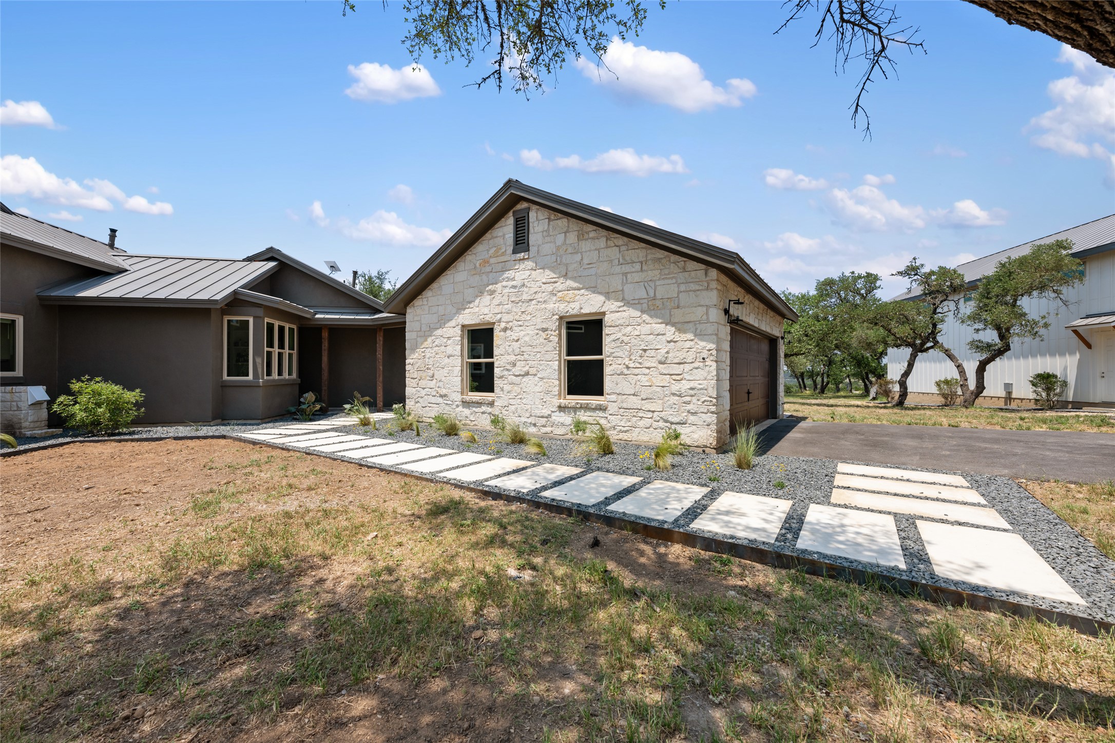 1276 Canyon Crossing View Dripping Springs, TX 78620 - Photo 21 of 33 a view of a house with backyard and sitting area