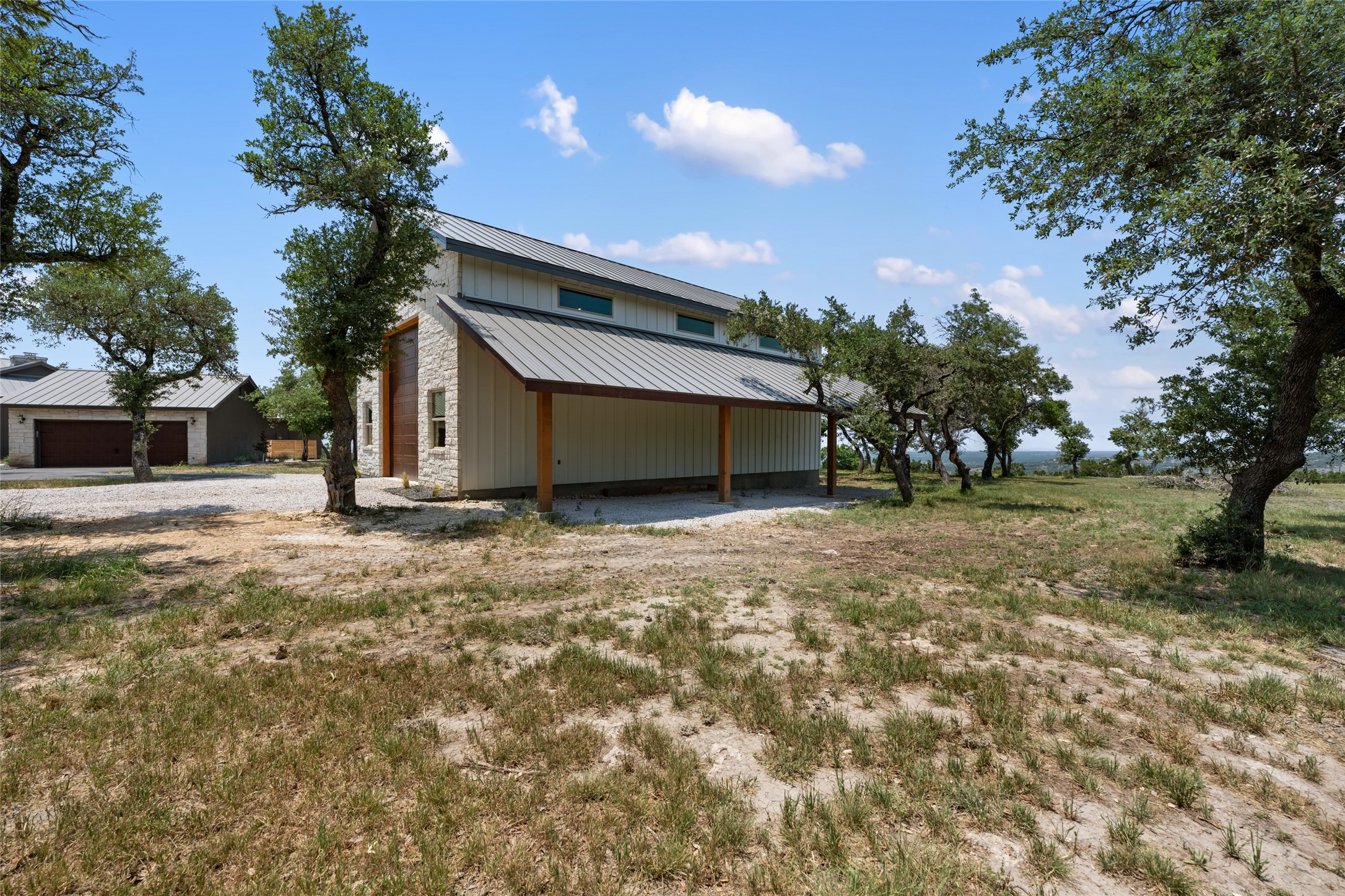 1276 Canyon Crossing View Dripping Springs, TX 78620 - Photo 27 of 33 a front view of a house with a yard