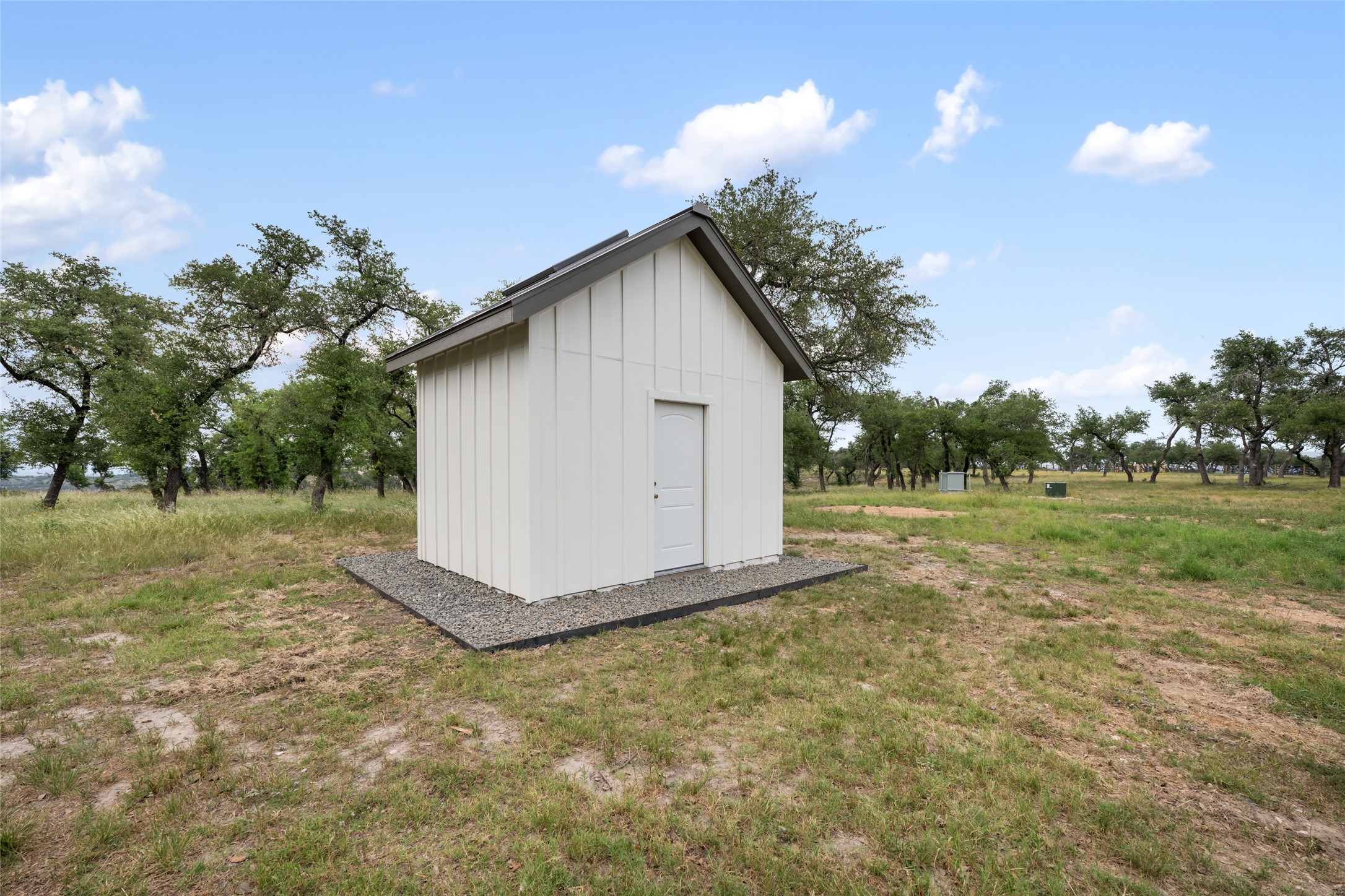 1276 Canyon Crossing View Dripping Springs, TX 78620 - Photo 28 of 33 a backyard of a house with lots of green space