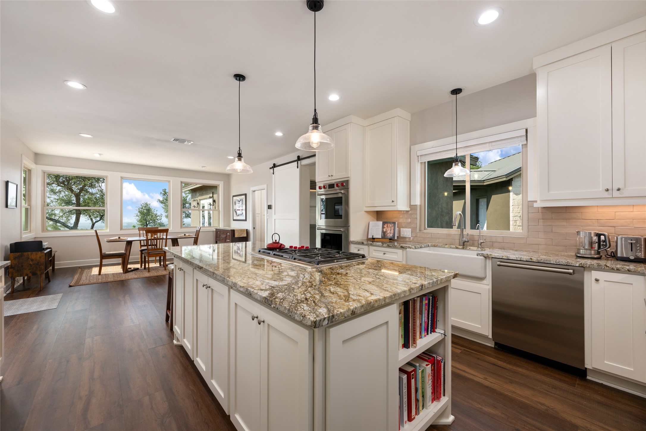 1276 Canyon Crossing View Dripping Springs, TX 78620 - Photo 9 of 33 a kitchen that has a lot of cabinets in it