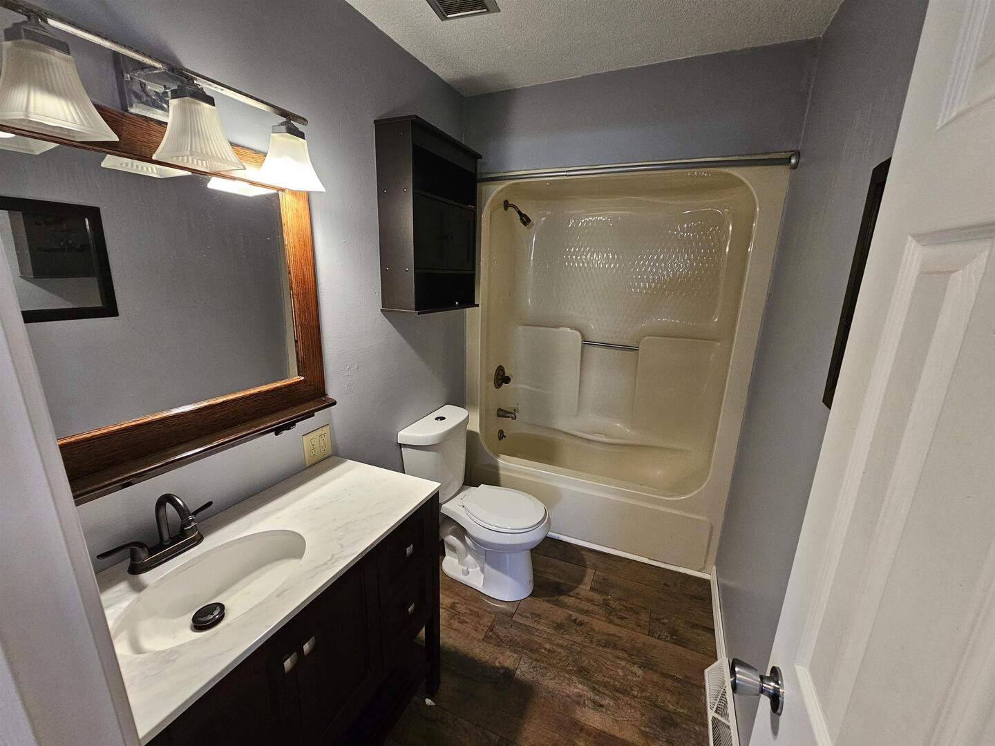 302 Marteeny Street Mount Vernon, IL 62864 - Photo 14 of 15 a bathroom with a sink toilet and shower