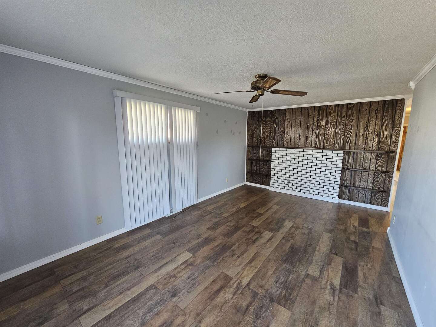 302 Marteeny Street Mount Vernon, IL 62864 - Photo 6 of 15 wooden floor in an empty room with a window