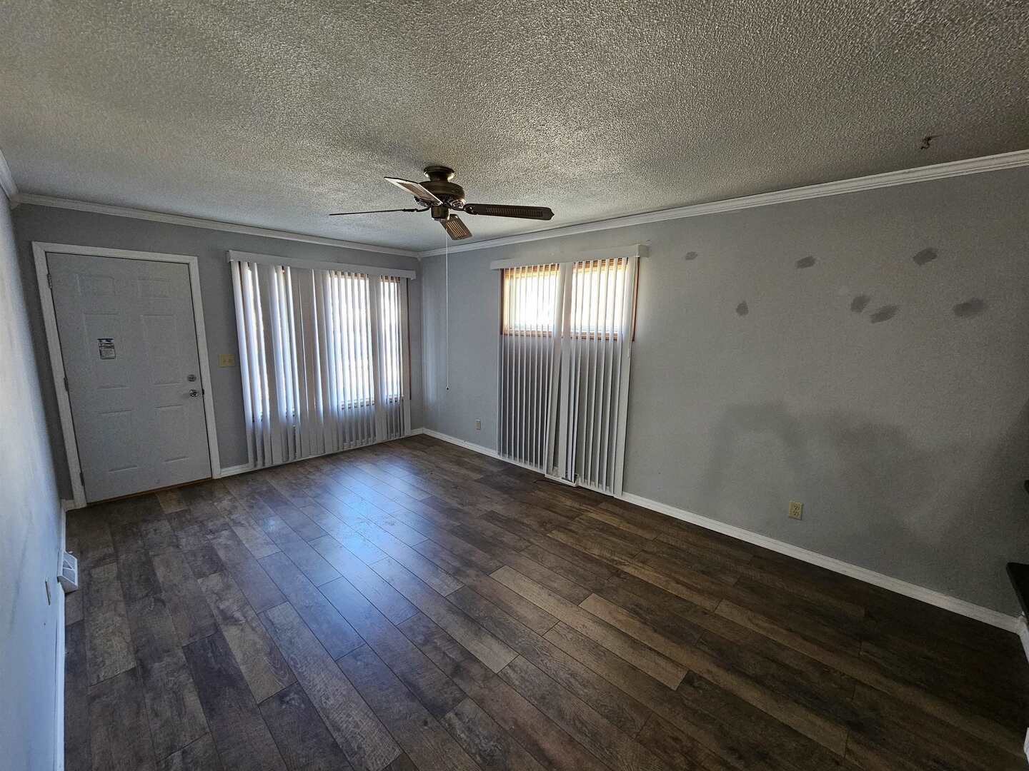 302 Marteeny Street Mount Vernon, IL 62864 - Photo 7 of 15 a view of an empty room with wooden floor and a window