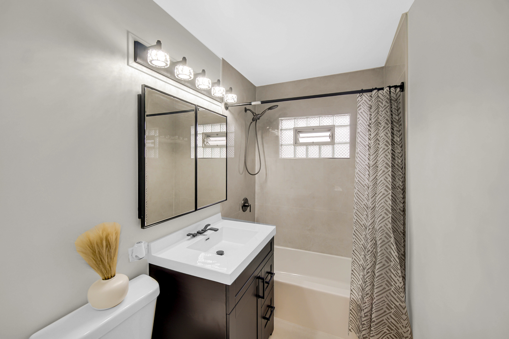14501 Tripp Avenue Midlothian, IL 60445 - Photo 12 of 19 a bathroom with a sink a toilet and shower