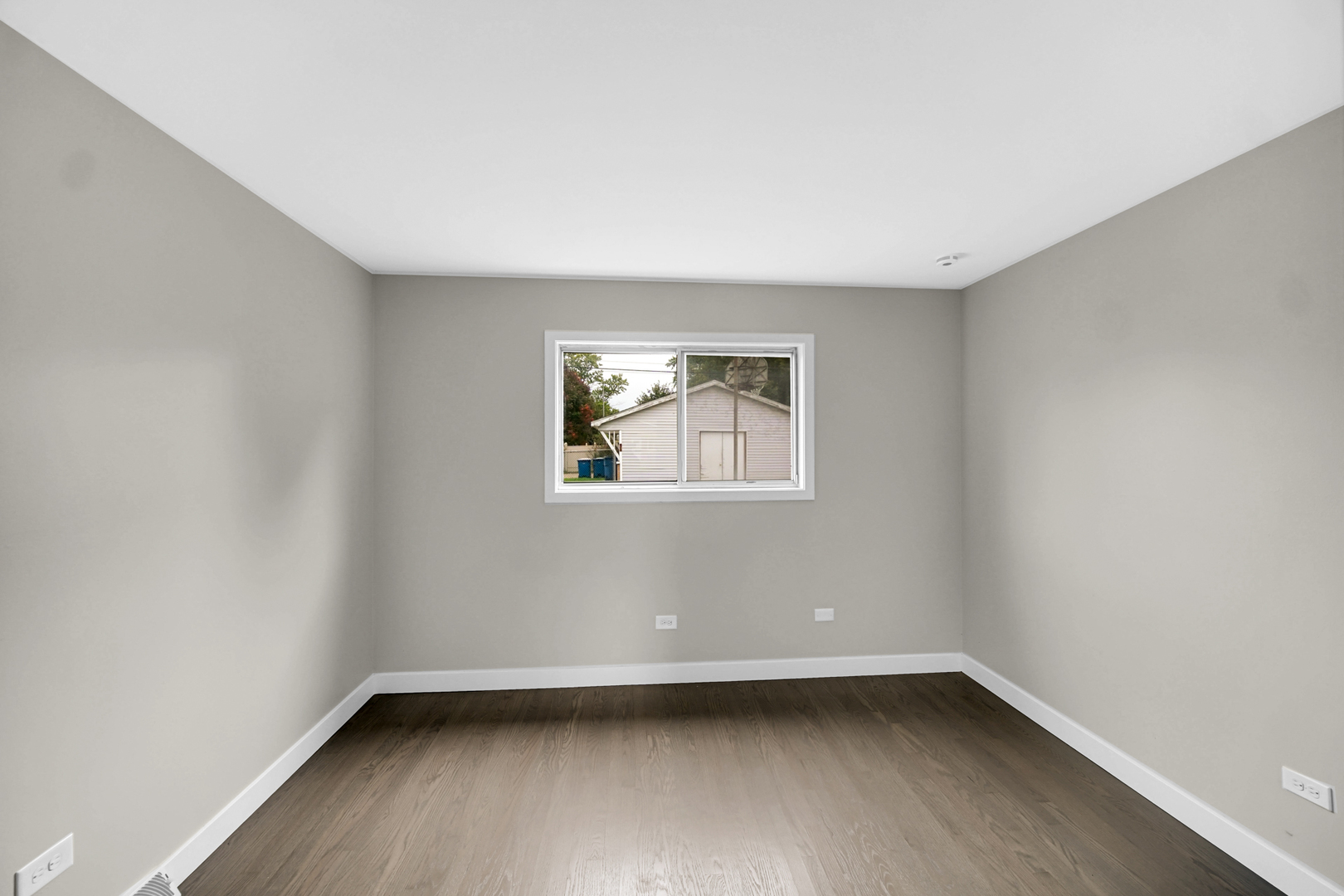 14501 Tripp Avenue Midlothian, IL 60445 - Photo 13 of 19 an empty room with a window