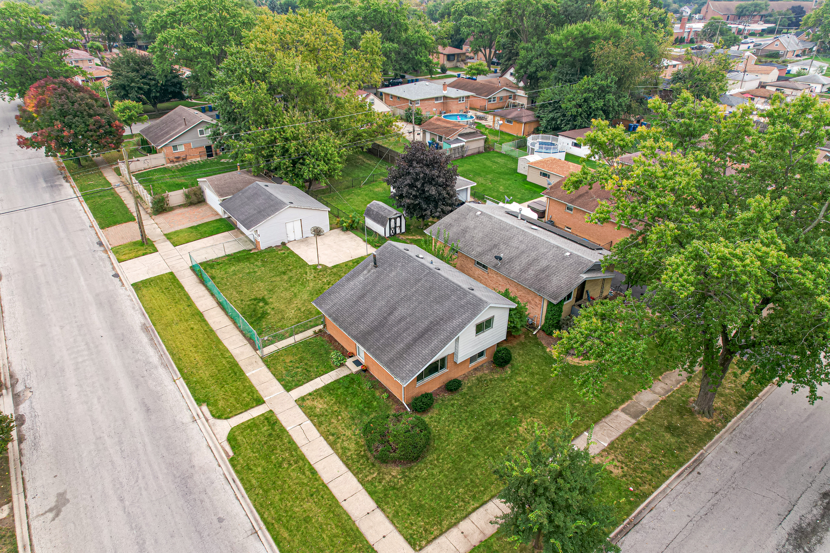 14501 Tripp Avenue Midlothian, IL 60445 - Photo 16 of 19 an aerial view of a house with swimming pool garden and patio