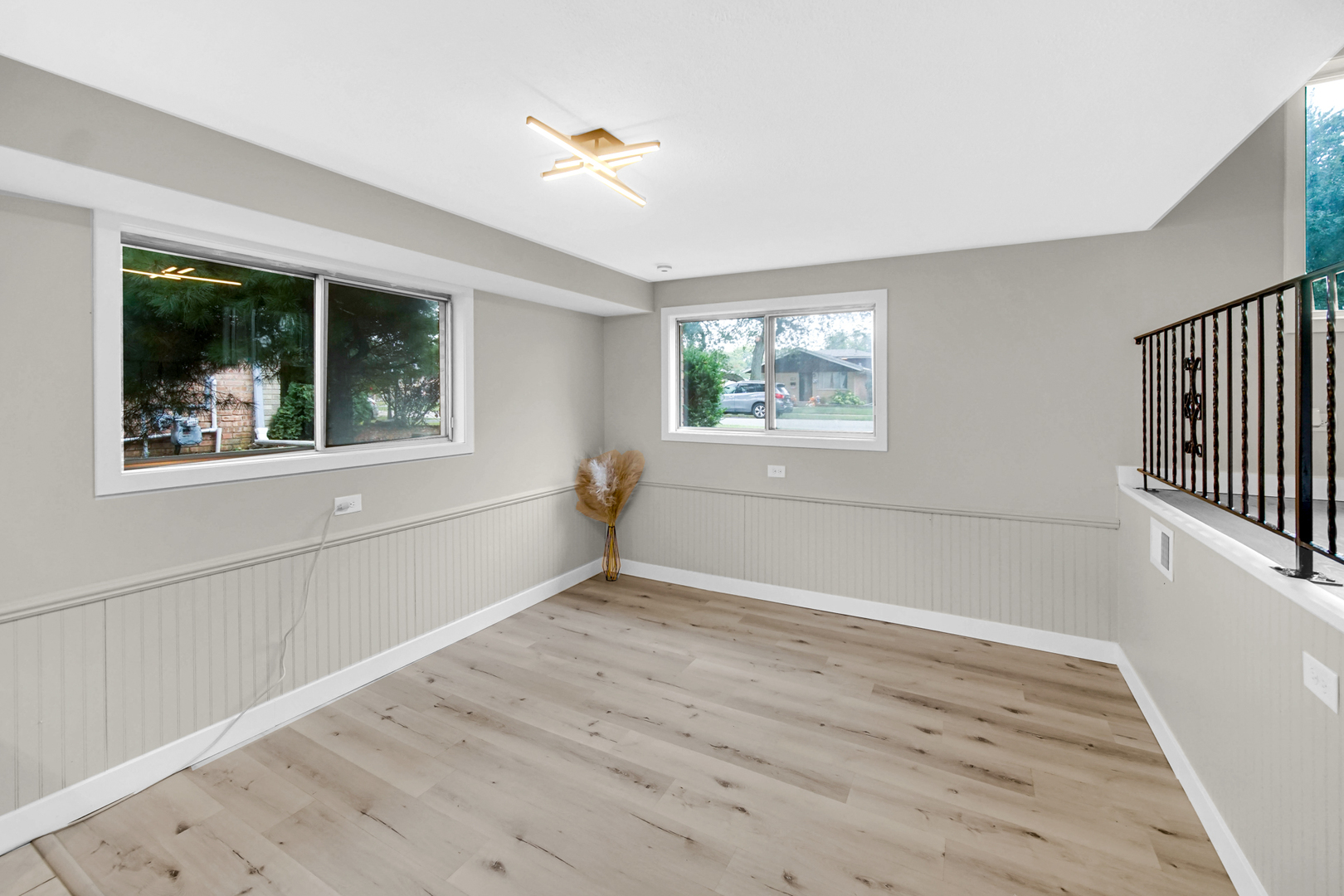 14501 Tripp Avenue Midlothian, IL 60445 - Photo 6 of 19 an empty room with wooden floor and windows