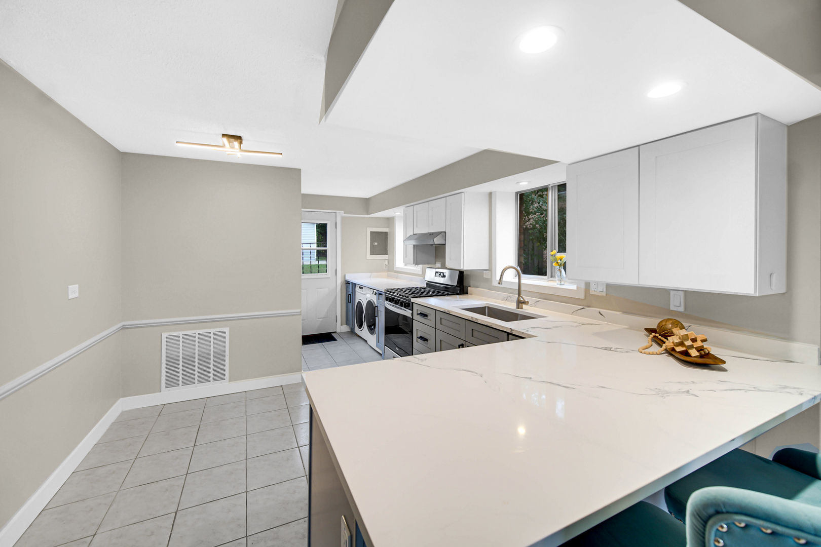 14501 Tripp Avenue Midlothian, IL 60445 - Photo 8 of 19 a view of a kitchen with kitchen island white cabinets and stainless steel appliances