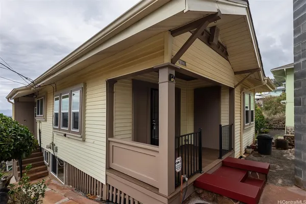 a view of a house with a door and wooden floor