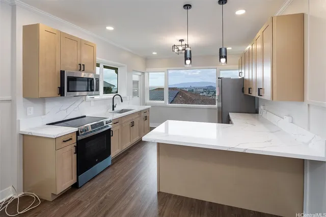a large kitchen with granite countertop a stove and a sink