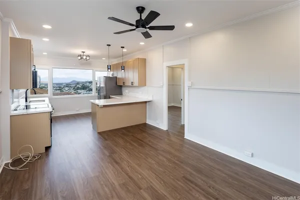 a view of kitchen with sink and wooden floor