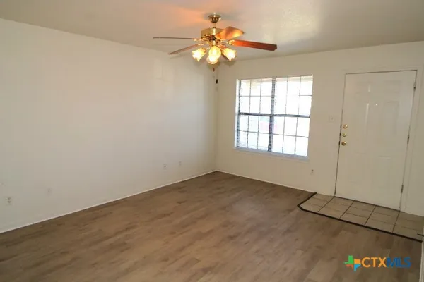 a view of an empty room with a window