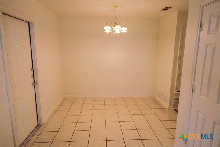 305 Cedar Ridge Drive, Unit B Nolanville, TX 76559 - Photo 7 of 14 a view of an empty room