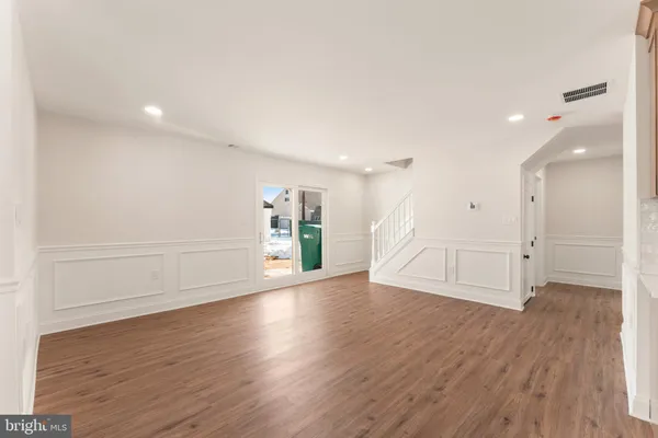 a view of a livingroom with wooden floor