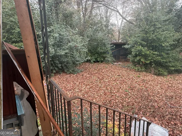 a view of a pathway of a building from a balcony