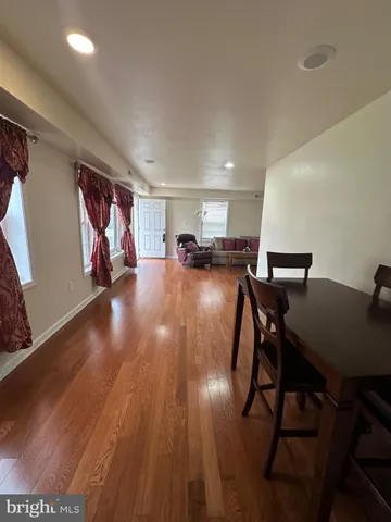 a view of a livingroom with furniture and wooden floor