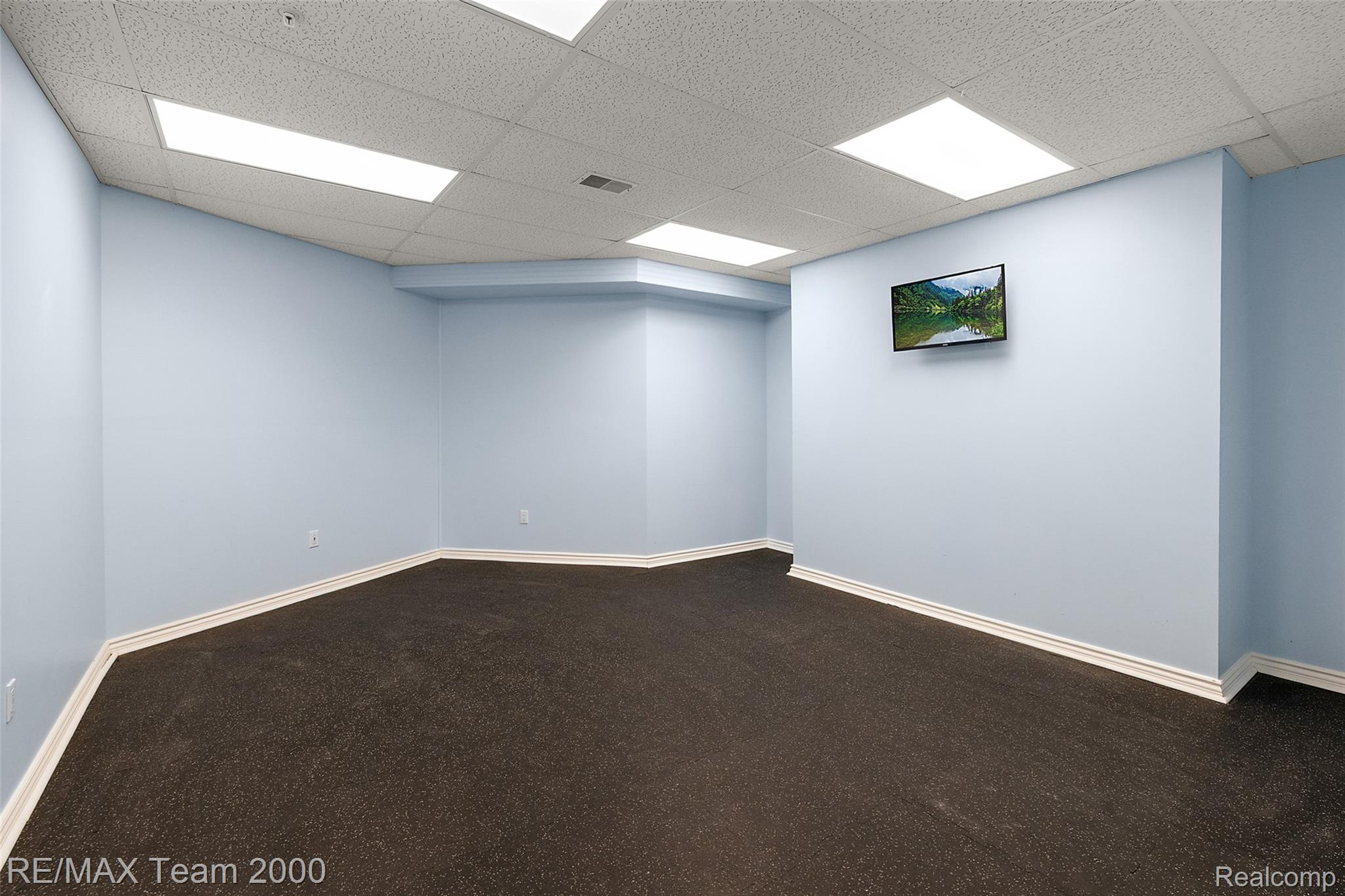 630 Sheldon Court Rochester, MI 48306 - Photo 84 of 94 Empty room featuring a drop ceiling and dark carpet