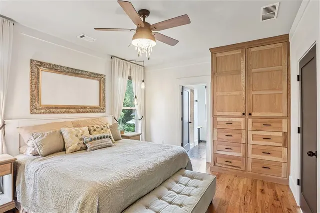 a bedroom with a bed and a flat tv screen