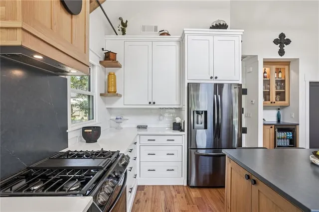 a kitchen with a stove and a refrigerator