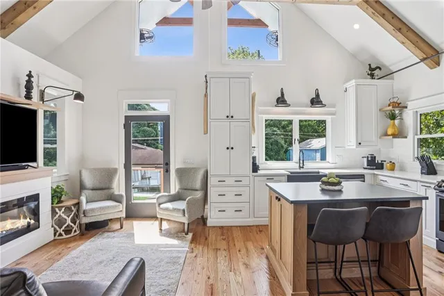 a view of a kitchen with dining table and chairs