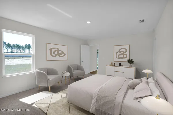 a bedroom with two beds and a large window