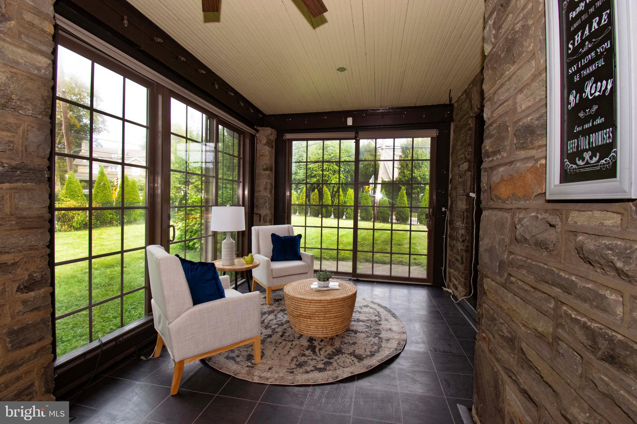 501 East Manoa Road Havertown, PA 19083 - Photo 13 of 42 a view of a dining room with furniture wooden floor and a potted plant