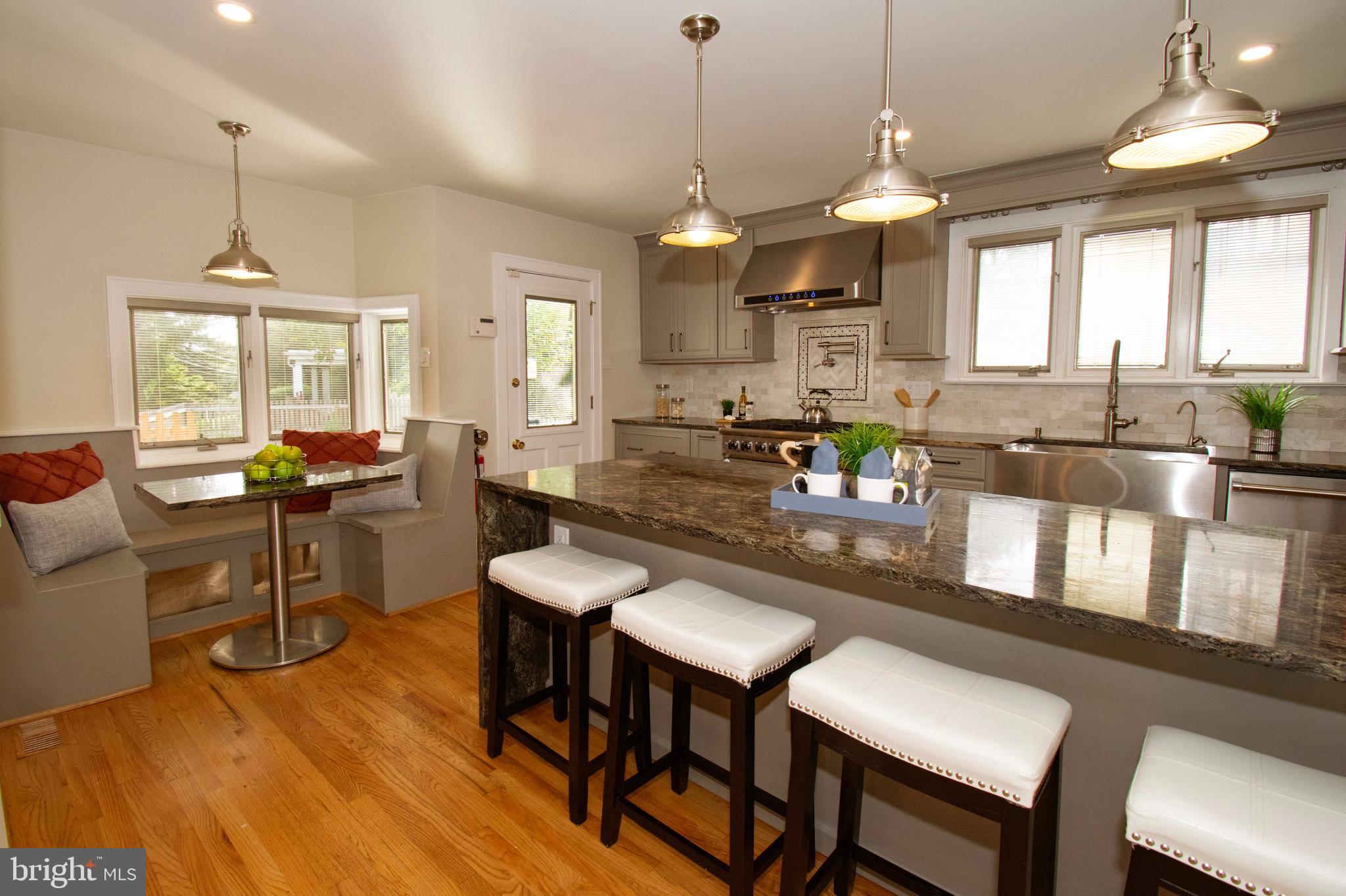 501 East Manoa Road Havertown, PA 19083 - Photo 17 of 42 a large kitchen with a table and chairs