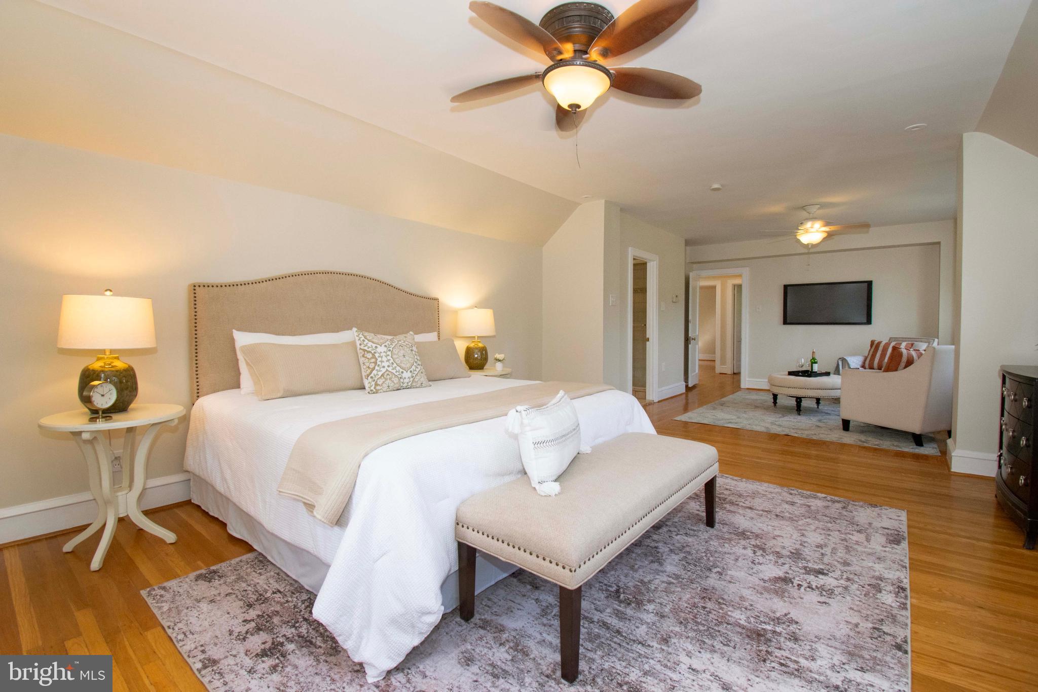 501 East Manoa Road Havertown, PA 19083 - Photo 23 of 42 a bed room with a bed and a chandelier