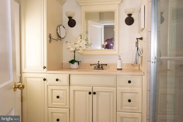 a bathroom with a sink and a mirror