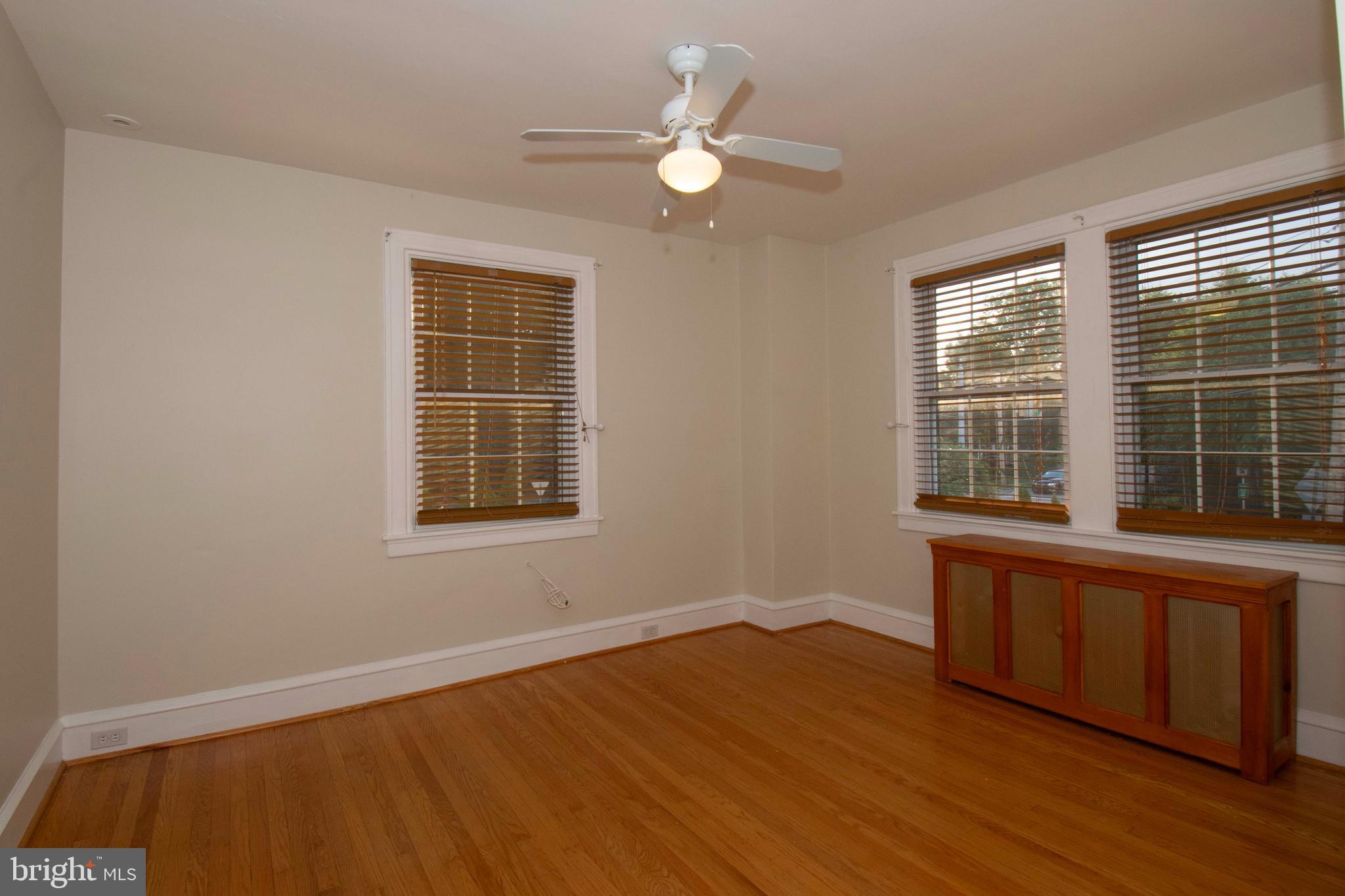 501 East Manoa Road Havertown, PA 19083 - Photo 27 of 42 a view of an empty room with wooden floor and a window