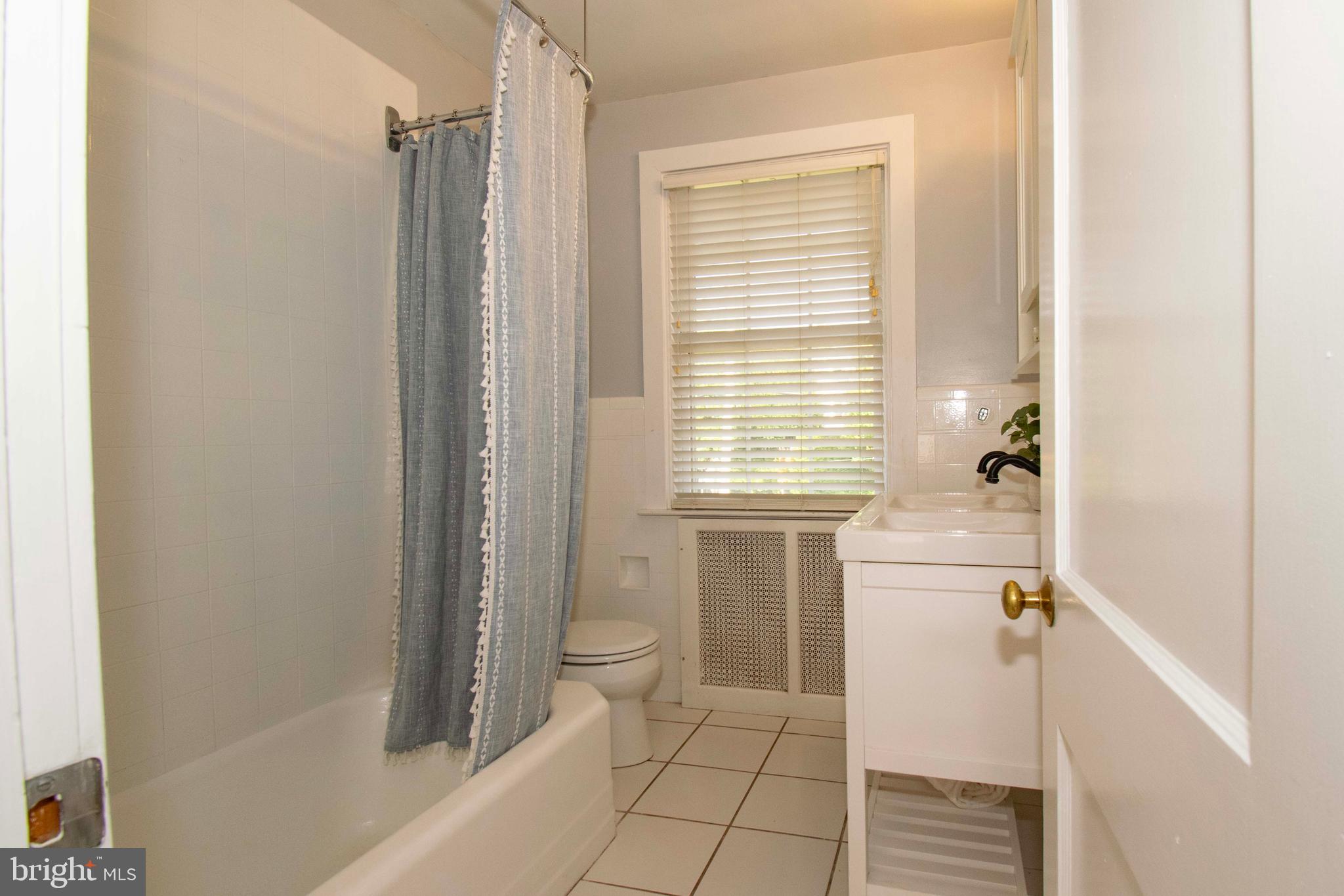 501 East Manoa Road Havertown, PA 19083 - Photo 29 of 42 a bathroom with a bathtub a sink and a shower