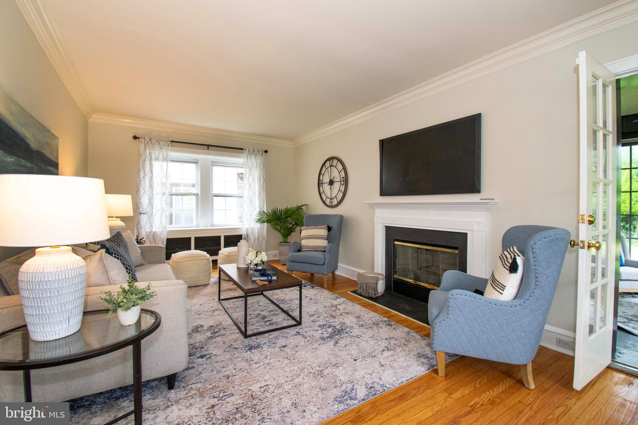 501 East Manoa Road Havertown, PA 19083 - Photo 6 of 42 a living room with furniture fireplace and a flat screen tv