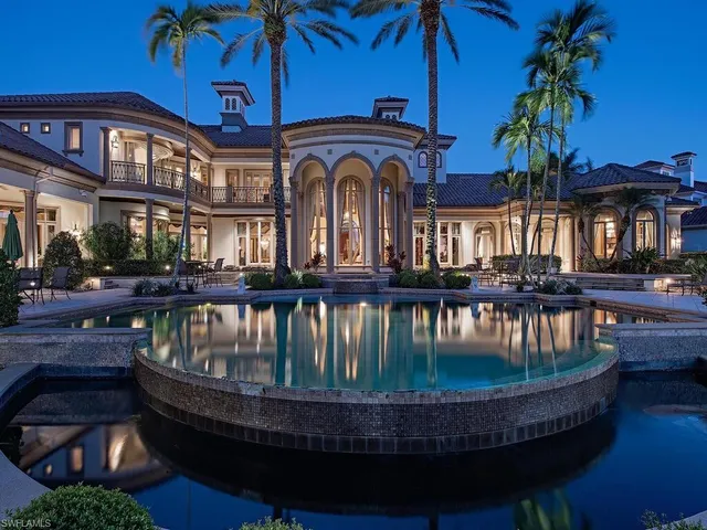 a view of building with swimming pool and porch