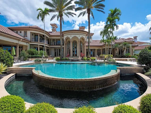 a view of a swimming pool with a patio