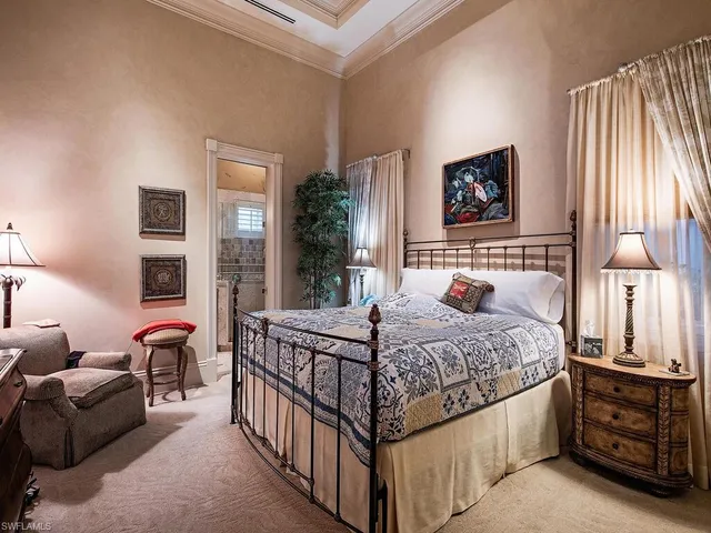 a bedroom with a bed and a view of bedroom