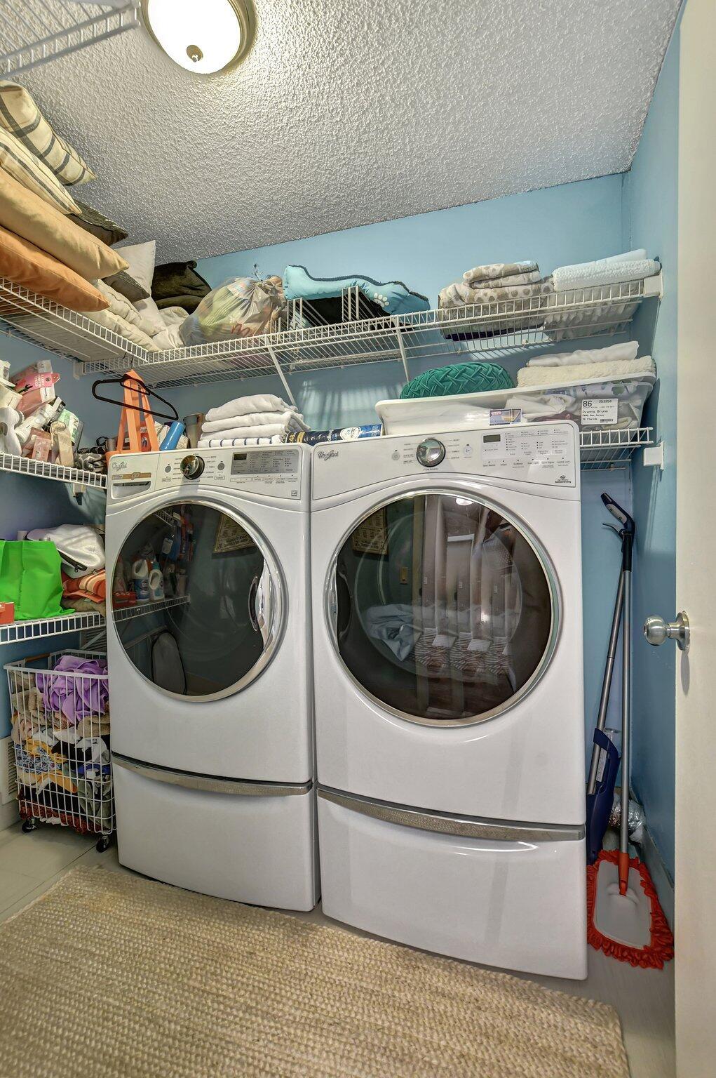 6682 Via Regina Boca Raton, FL 33433 - Photo 17 of 46 a utility room with dryer and washer
