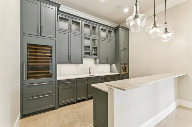 a kitchen with a sink and cabinets