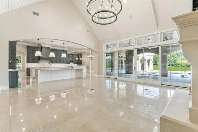 a view of a room with kitchen island and a large window