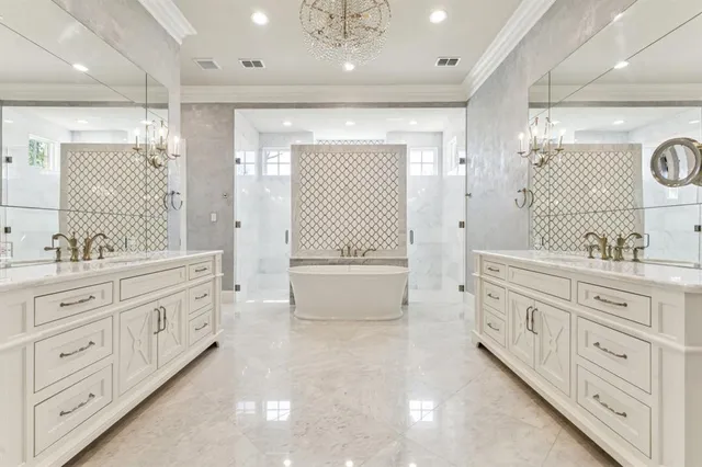 a bathroom with a granite countertop double vanity sink a mirror a shower and a bathtub