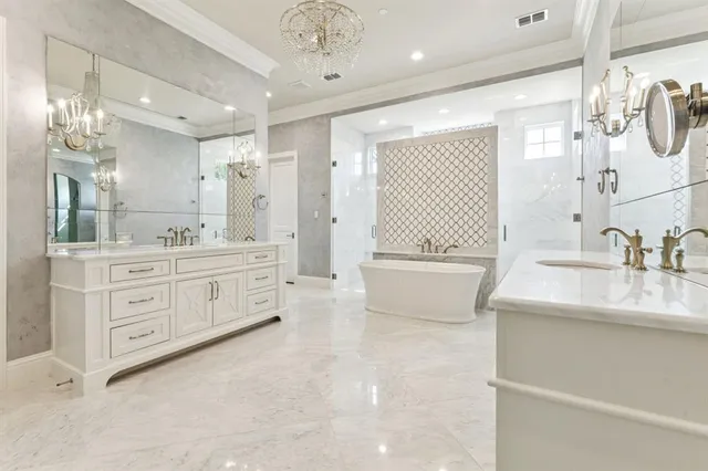 a bathroom with a double vanity sink a mirror a bathtub and shower