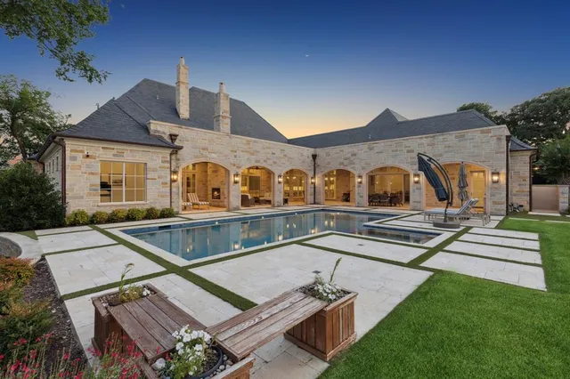 a view of a house with pool table and chairs