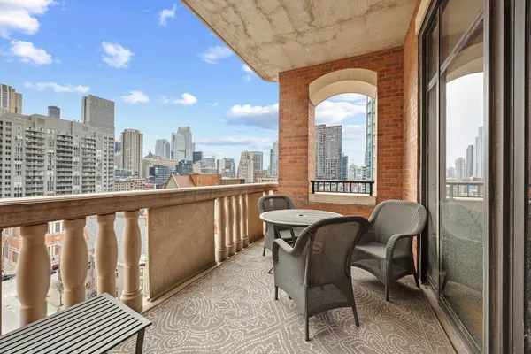 a view of a balcony with chairs