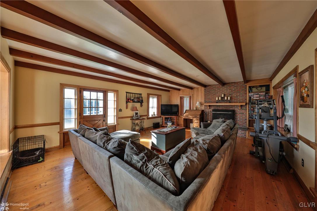 526 West Moorestown Road Nazareth, PA 18064 - Photo 13 of 50 a living room with fireplace furniture and a flat screen tv