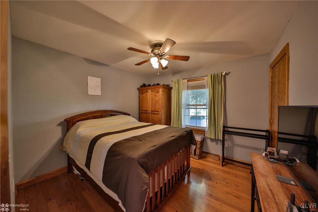 526 West Moorestown Road Nazareth, PA 18064 - Photo 16 of 50 a bedroom with a bed and a flat screen tv